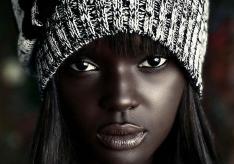 Is dark-skinned model Duckie Thot a doll or a person?